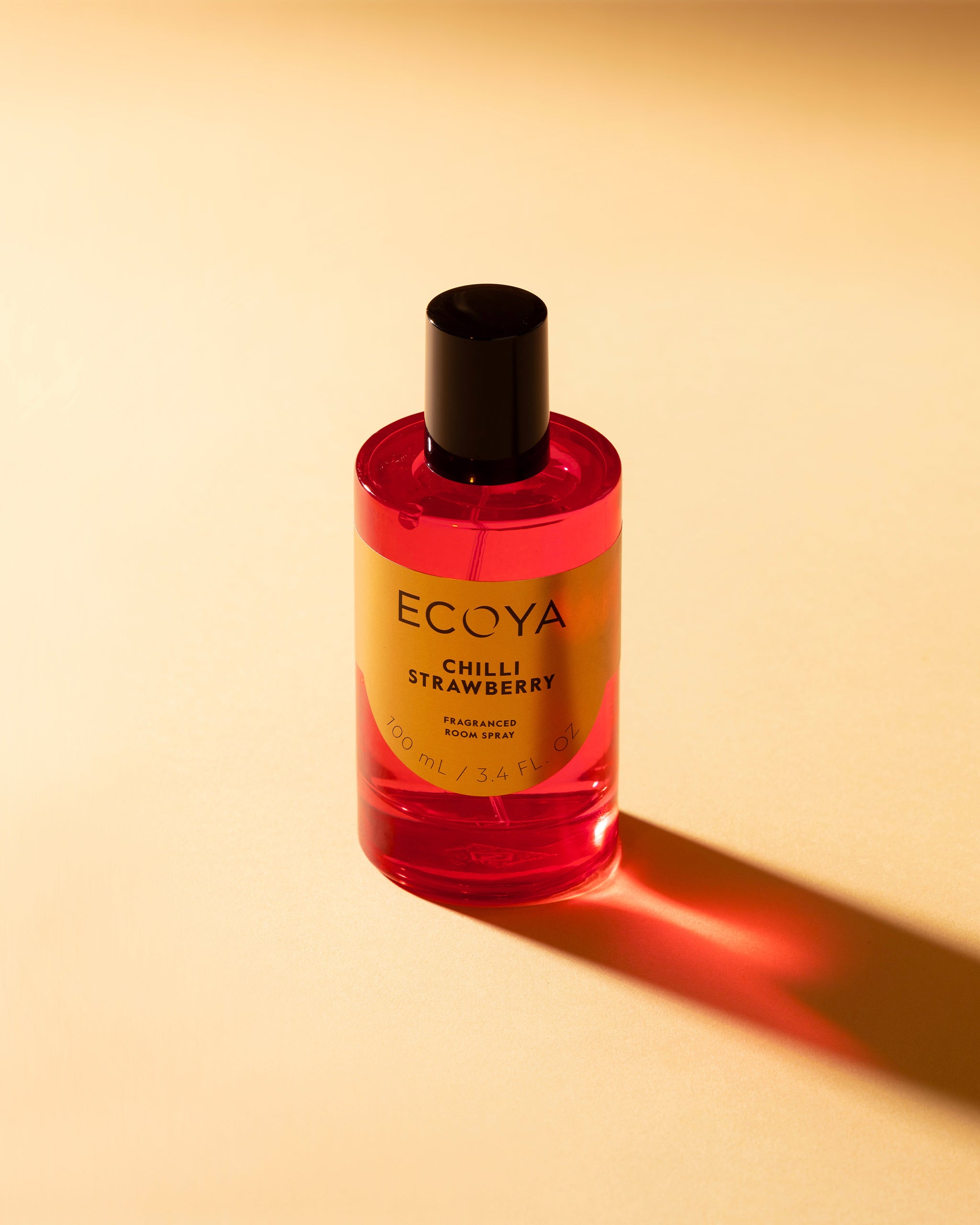 Ecoya Chilli Strawberry perfume bottle on a beige background