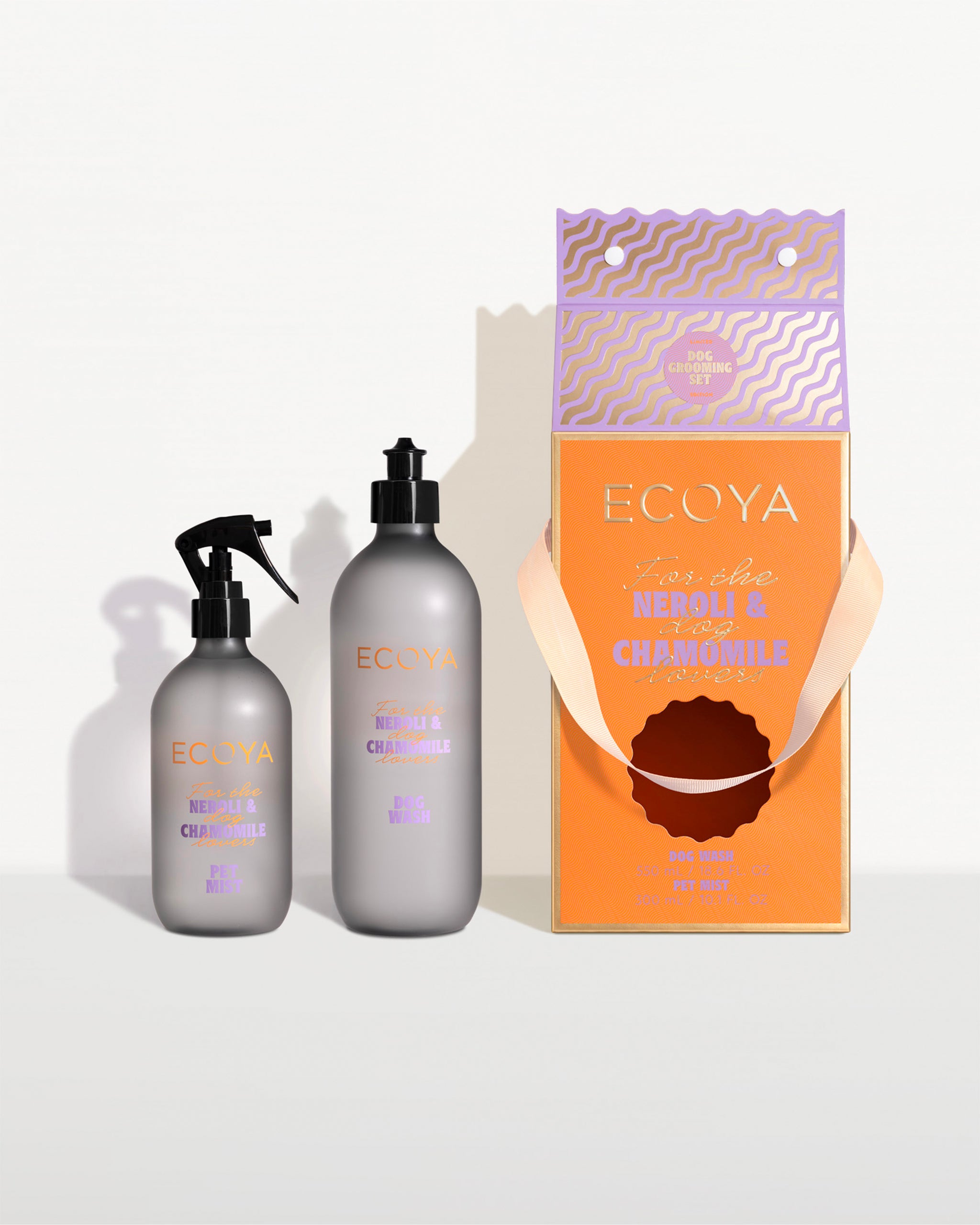 ECOYA dog grooming set made with grey bottles presented in orange and purple gift set